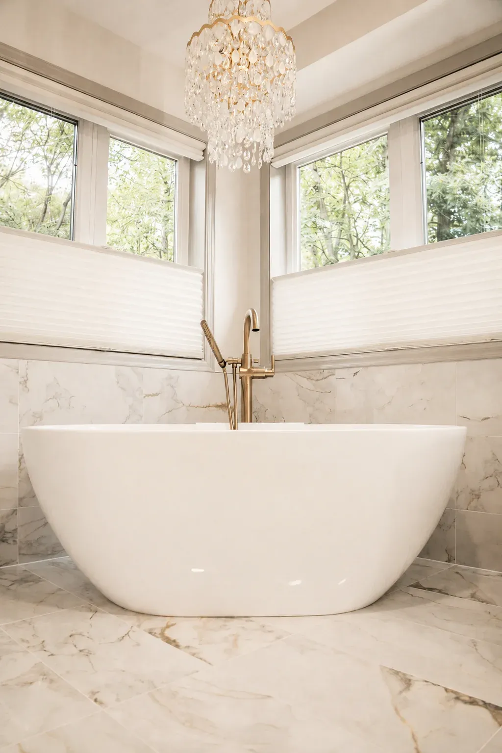 Freestanding soaking tub replacing corner tub in Burnsville primary bathroom remodel by Honey-Doers Remodeling