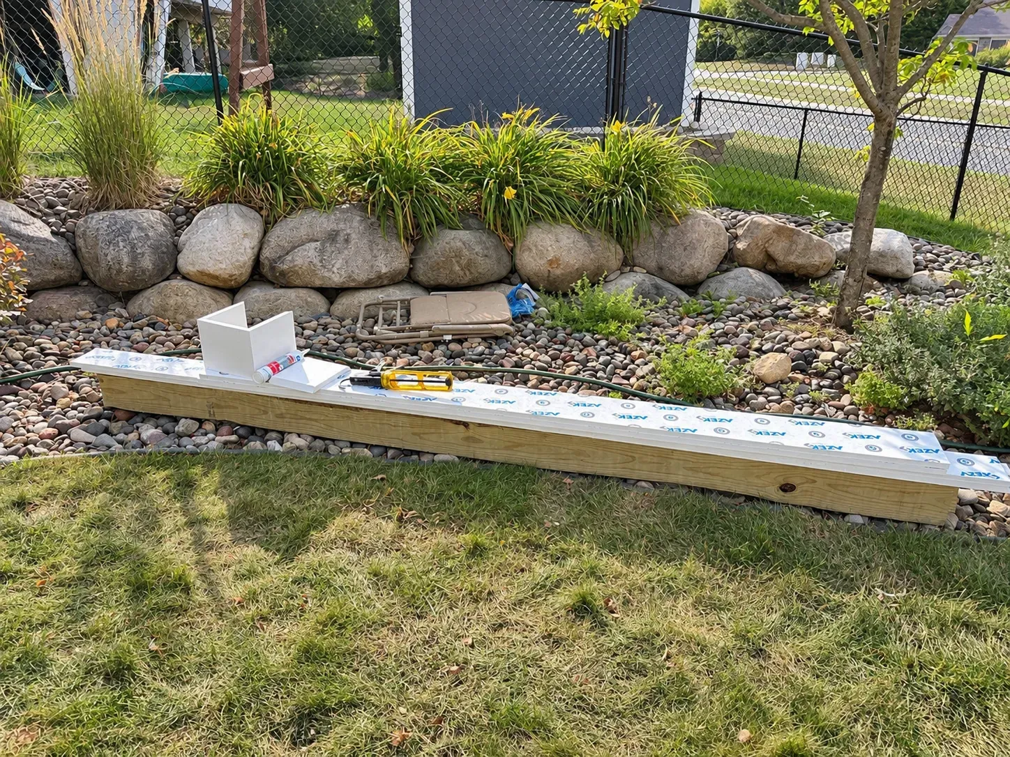 Helical footing materials staged in the yard for the Eagan deck rebuild