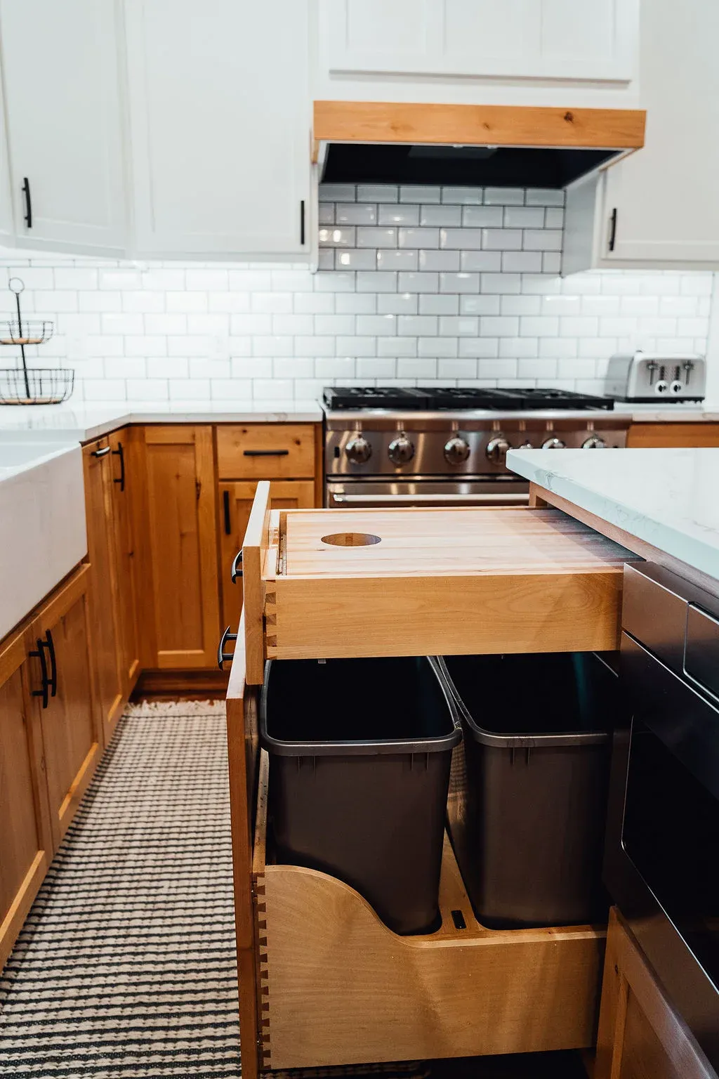 Custom pull-out storage placed near the range in a Lakeville kitchen remodel by Honey-Doers Remodeling