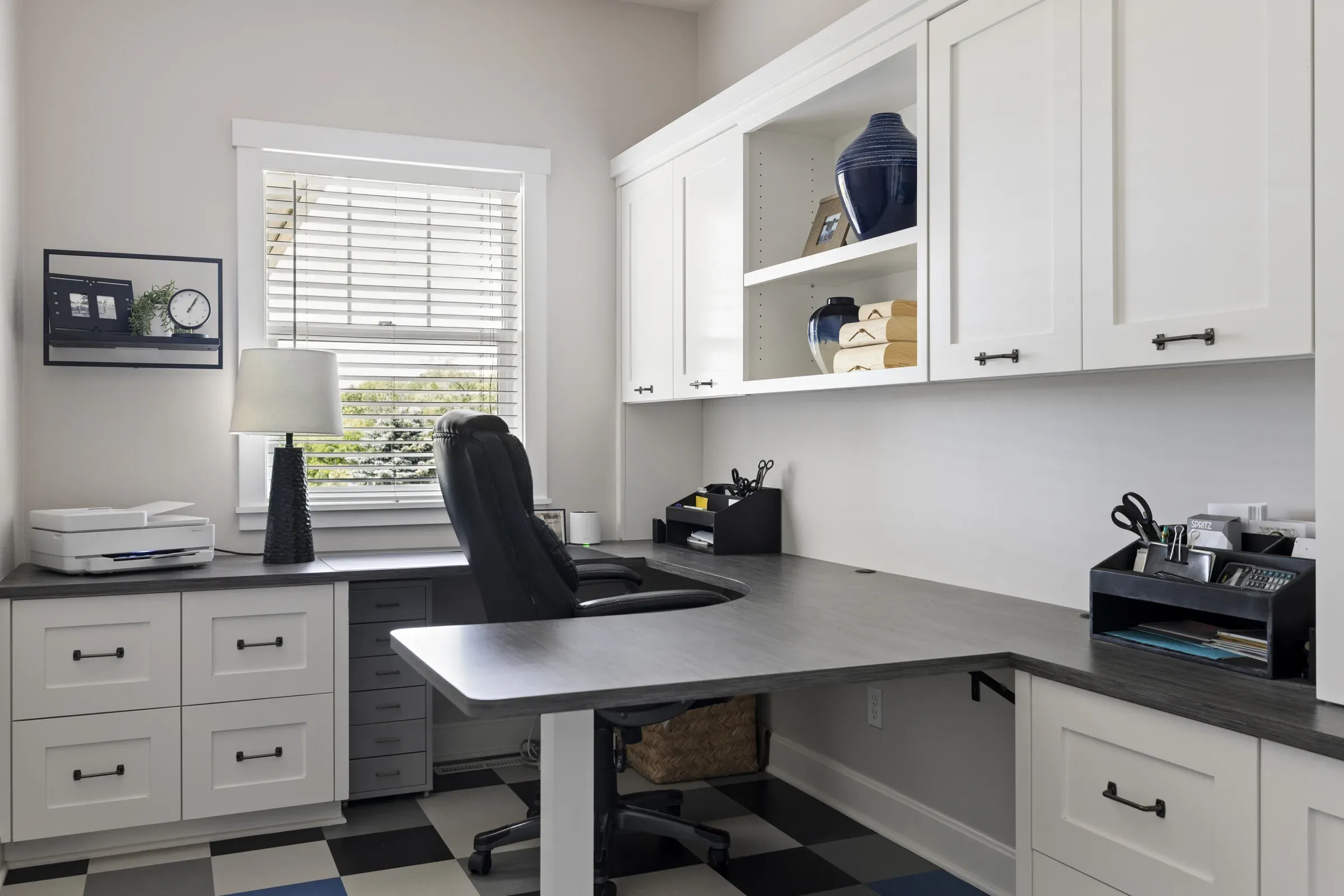Finished Lakeville laundry room, mudroom, and home office remodel with custom cabinetry and luxury vinyl tile flooring by Honey-Doers Remodeling