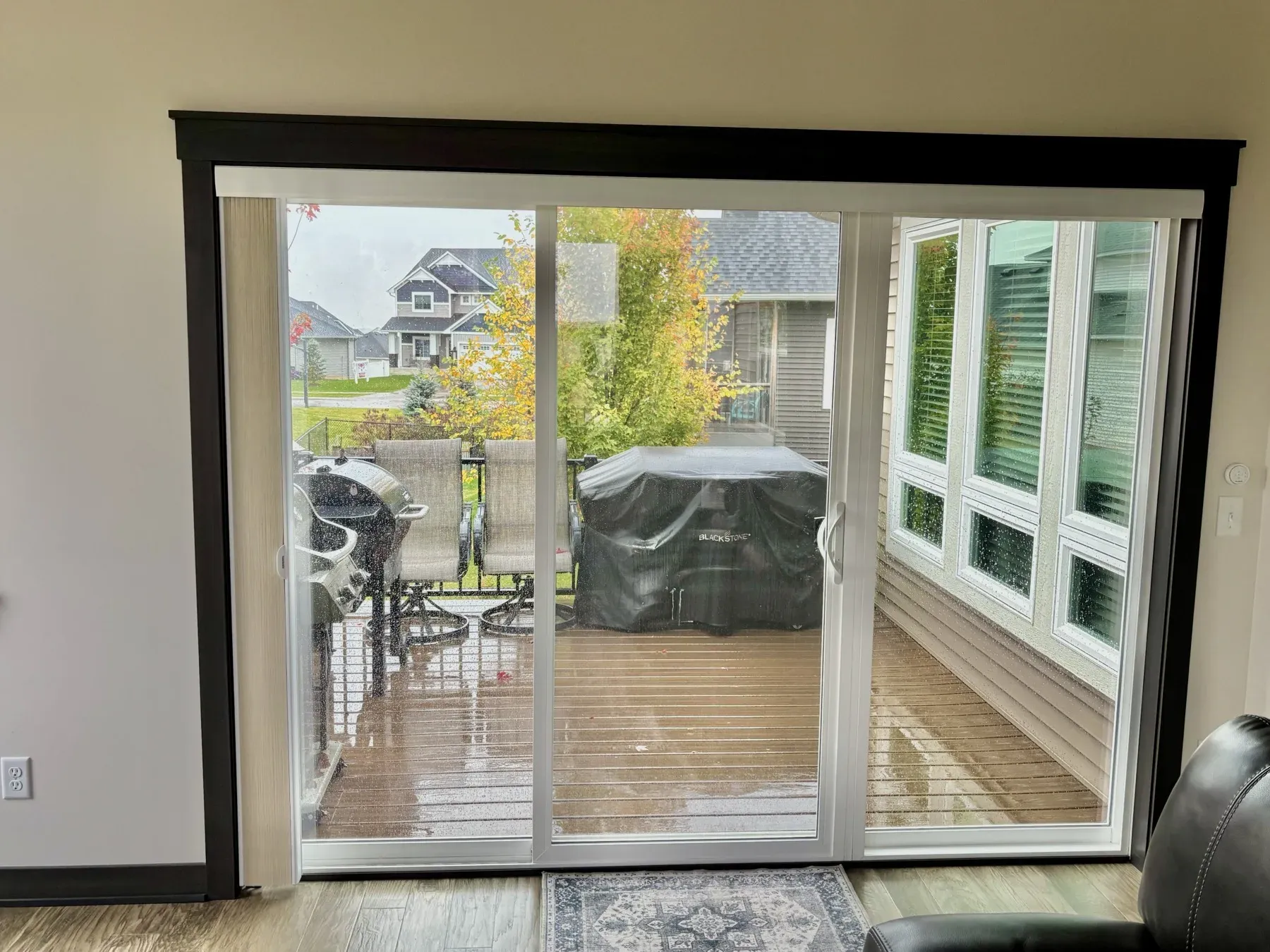 Reused sliding door leading from the Lakeville porch out to the composite grilling deck