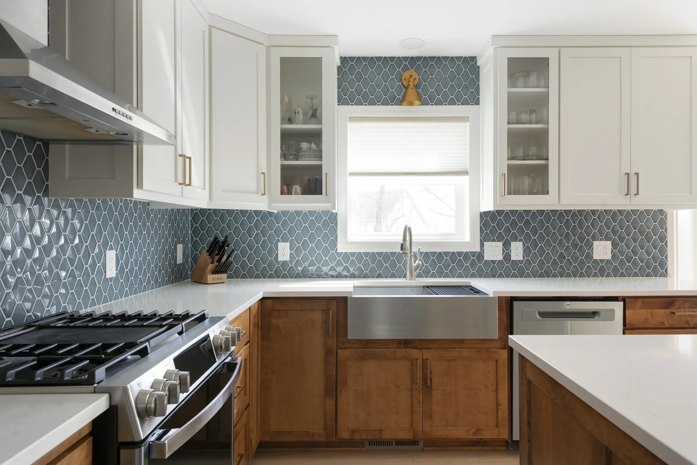 Ceiling-height kitchen cabinetry with stainless farmhouse sink and blue-green tile backsplash – Honey-Doers Remodeling, Elko New Market MN