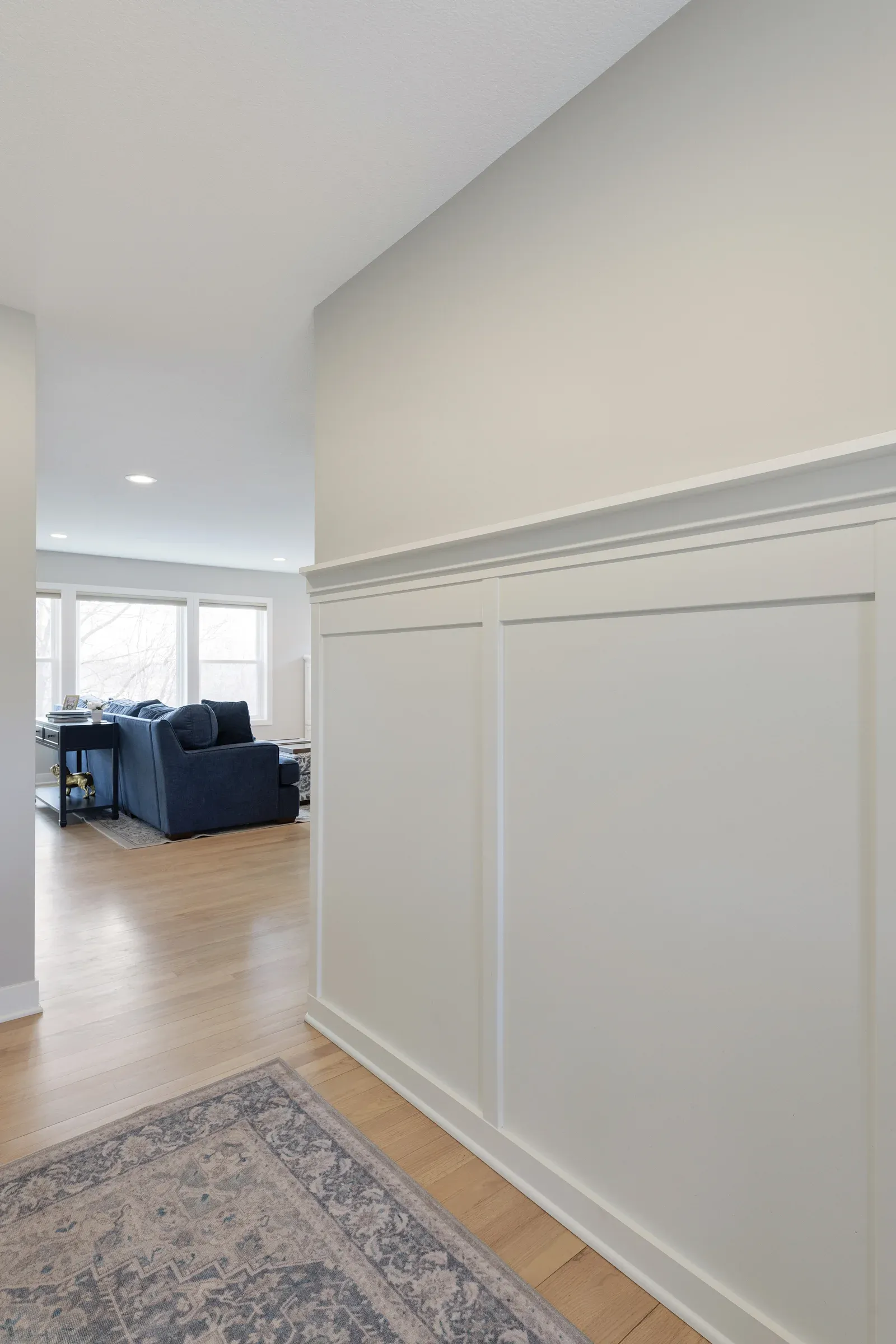 Board and batten wall treatment with picture rail at main-level entry – Elko New Market home remodel by Honey-Doers Remodeling