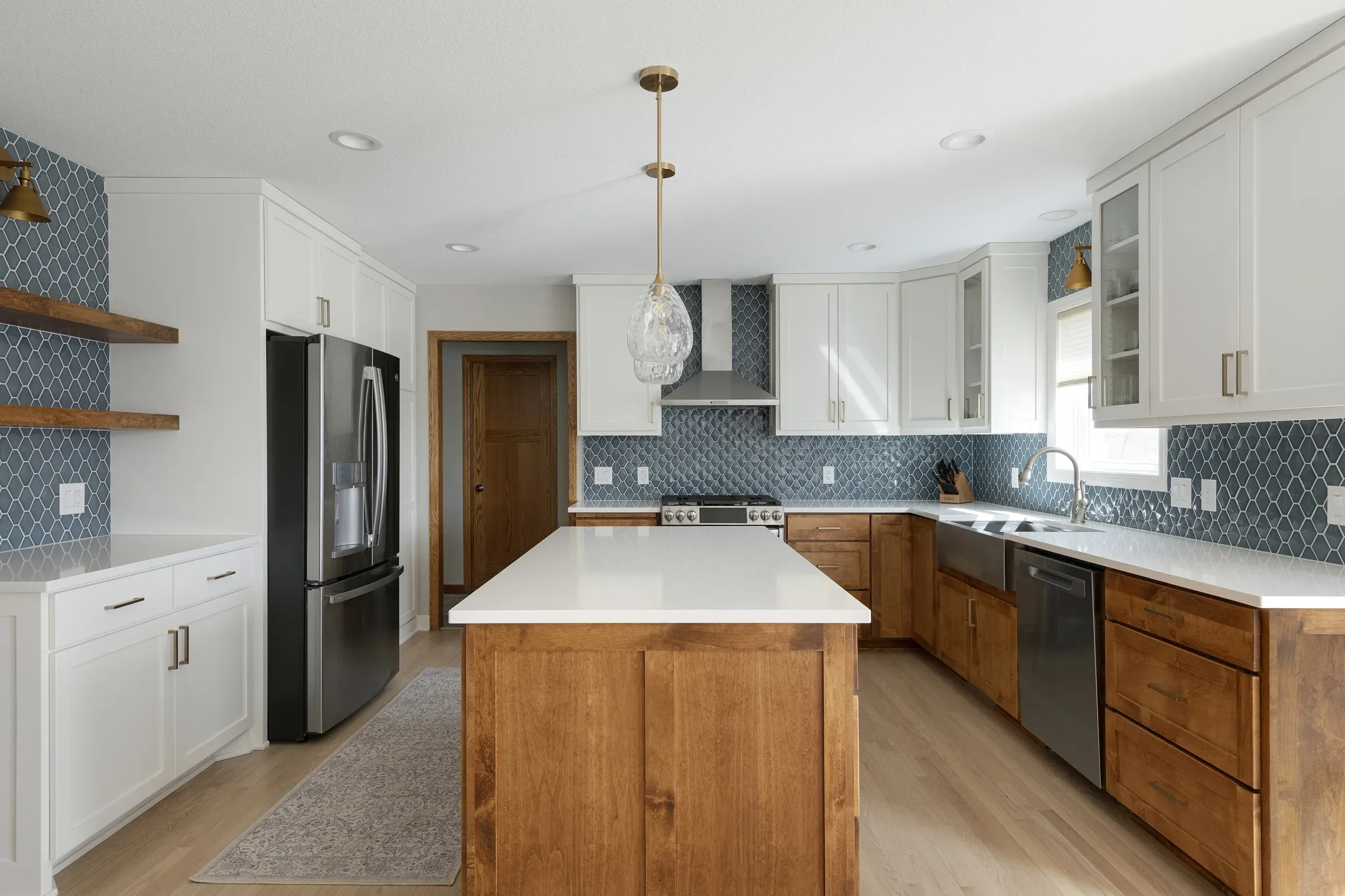 Finished kitchen remodel in Elko New Market MN – island, hardwood floors, and custom cabinetry by Honey-Doers Remodeling